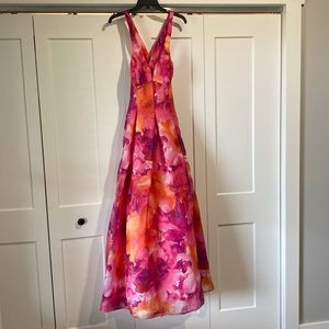 Flowered prom/homecoming dress with crossed back and v neck front.
